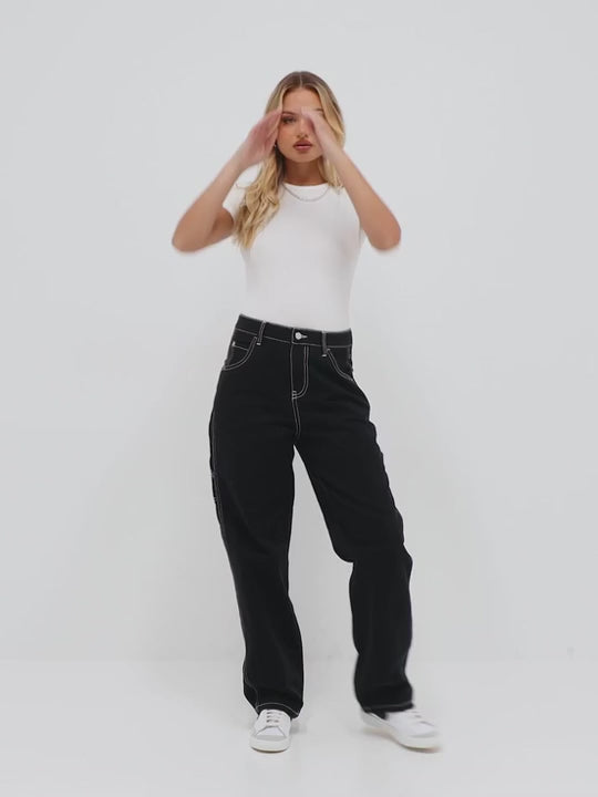 White bodysuit paired with black jeans